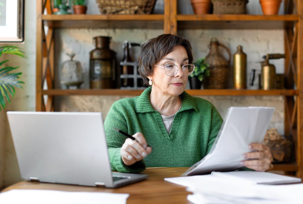 A,Mature,Woman,During,A,Document,Check.,She,Checks,The